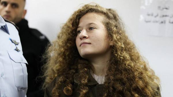 Palestinian Teen Ahed Tamimi Enters A Military Courtroom At Ofer Prison, Near The West Bank City Of Ramallah